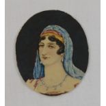 A late 19th/early 20th century oval portrait on ivory of a woman wearing pearls earrings and