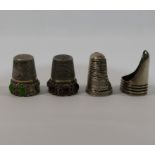 Two silver coloured metal thimbles, set with amethyst coloured and green stone oval cabochons,