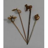 An opal, half seed pearl and garnet set gold insect tie pin, an opal set tie pin stamped '15CT',