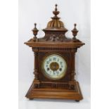 A late 19th Century carved walnut "Greenwich" mantel clock with striking movement and Arabic