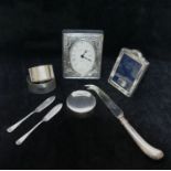 A collection of eight small silver items comprised of a clock with silver frame, London 1996,