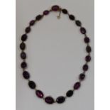 A 19th century amethyst riviere necklace, comprised of 25 foil backed graduated stones,