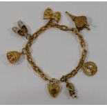 A 9 carat gold charm bracelet, with heart-shaped padlock clasp,