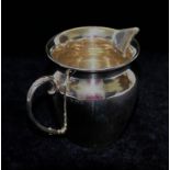 A George V silver milk jug, Birmingham 1937, 2.86ozt, 88.9g, 7.