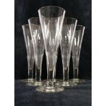 A set of six panel cut glass flutes,