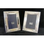 A pair of rectangular silver photograph frames,