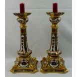 A pair of Royal Crown Derby candlesticks decorated in the Imari palette, dated 1983, numbered 1128,