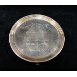 A small silver circular card tray, Sheffield 2002, raised on three feet,