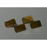 A pair of 9 carat gold cuff links with engine turned decoration, Birmingham 1984, combined weight 6.