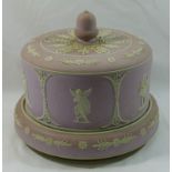 A Victorian lilac jasperware cheese bell, decorated with cherubs playing musical instruments,