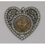A 19th century paste set silver heart-shaped pendant,