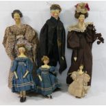 Six 19th century Grodnertal style dolls with painted composite faces and wooden limbs,