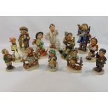 Twelve Goebel figures by M J Hummel, including the 'Little Pharmacist', 4.