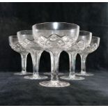 A set of six cut glass champagne coupes with hollow stems, 12.