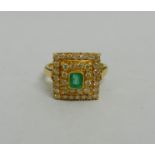 An emerald and diamond square cluster ring, possibly Indian,