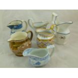 Six 18th century and 19th century cream jugs including a pearlware helmet-shaped jug,