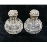 A pair of late Victorian silver mounted cut glass scent bottles, of ovoid form, London 1898,