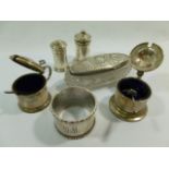 A collection of small silver items comprised of a mustard pot and pepperette, Birmingham 1927,