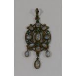 A late 19th/early 20th century openwork oval moonstone set pendant, with three moonstone drops,