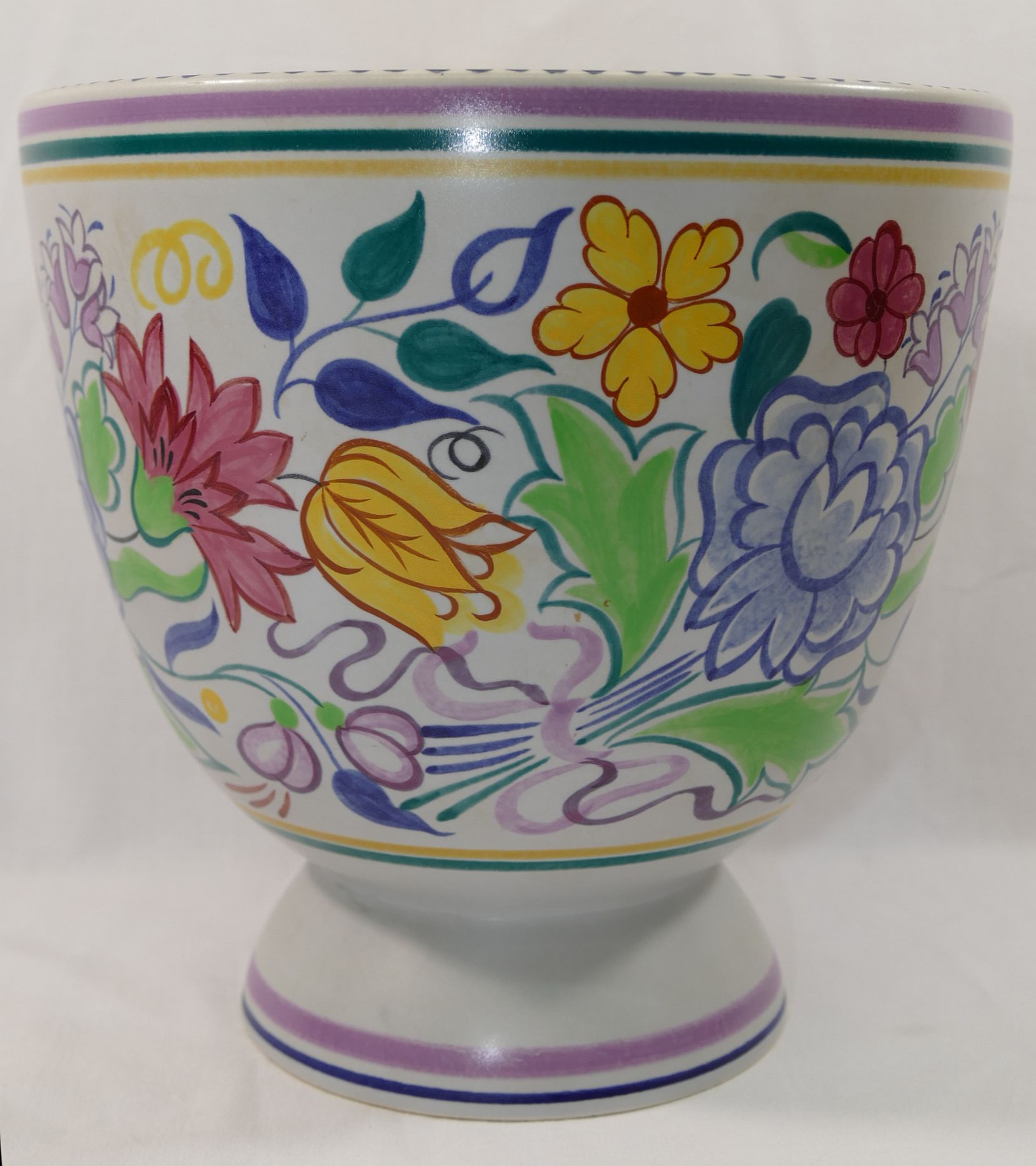 A large Poole Pottery footed vase, decorators mark to base X/BN,