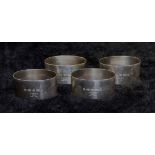 A set of four silver oval napkin rings,