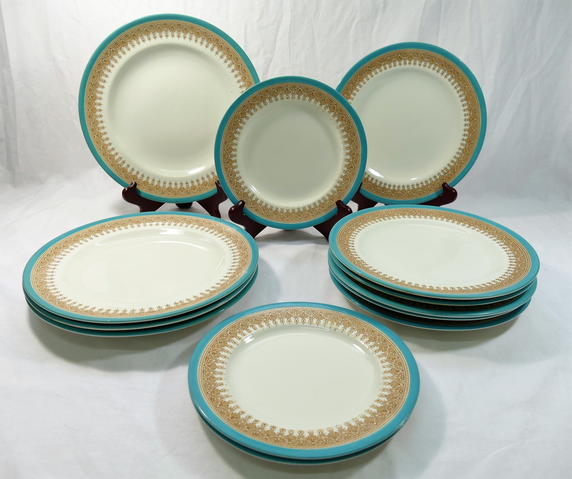 Thirteen late 19th century 'Royal Worcester Vitreous' plates, comprised of four measuring 26.