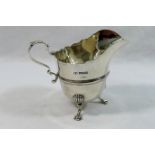 A George V silver helmet-shaped cream jug, Sheffield 1915, 9cm high, 3.47ozt, 107.