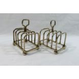 A pair of George V silver five bar toast racks, London 1930, 7.7cm long, combined weight 4.