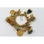 A 15 carat gold curb link charm bracelet, the clasp stamped '15CT',