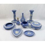 A collection of nine pieces of modern Wedgwood blue jasperware comprised of a pair of candlesticks,