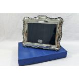 A decorative silver photograph frame, Sheffield 1996, by Richard Carr, 19.3cm wide x 15.