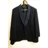 A Hector Powell black dinner jacket and trousers with black cummerbund and bow ties The property