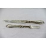 A large Victorian silver serving knife and fork with formal engraved decoration, Birmingham 1877,