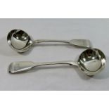 A pair of early Victorian fiddle pattern silver sauce ladles, London 1856 by Charles Stuart Harris,