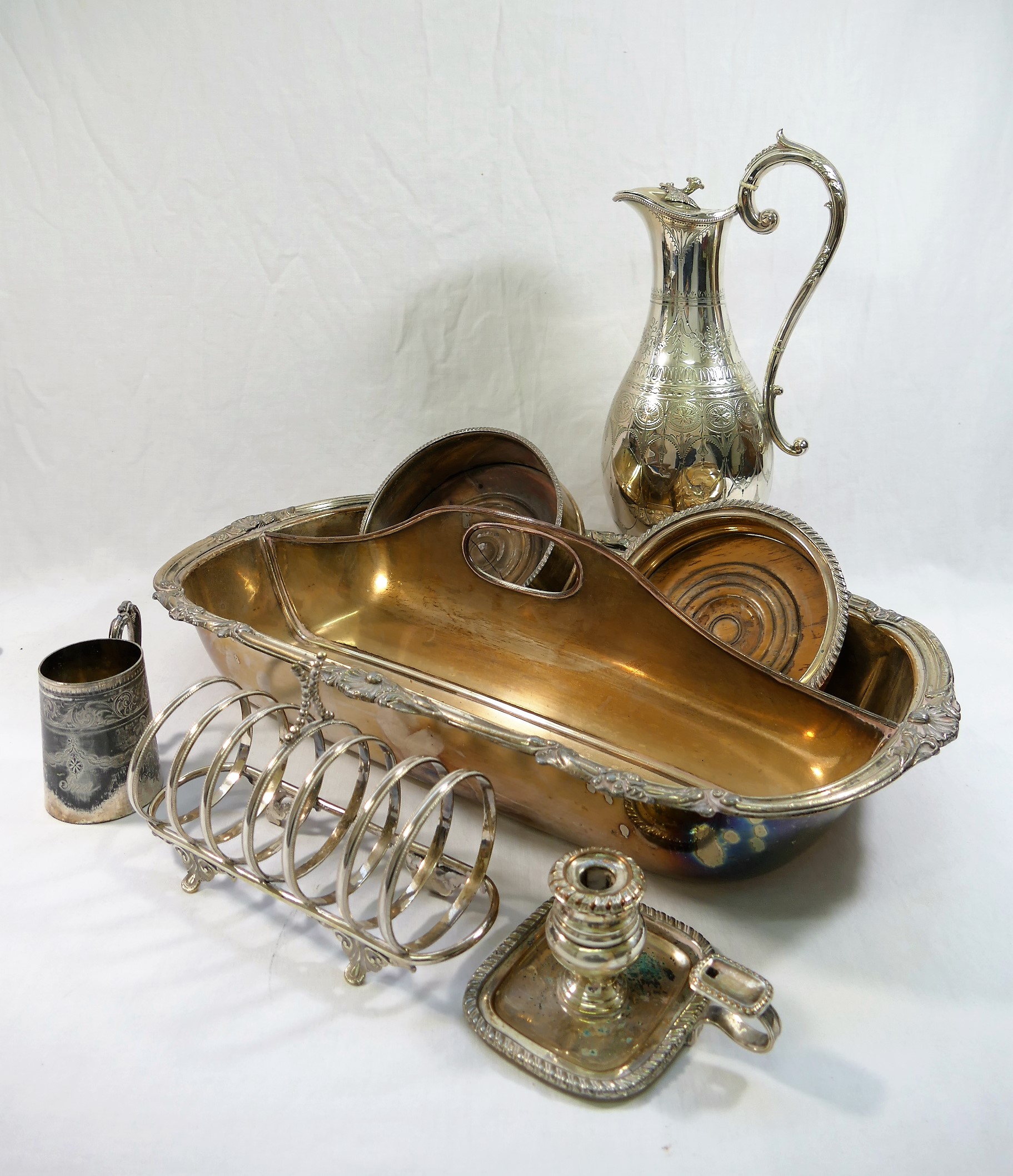 A silver plated claret jug, 34cm high, a silver plated cutlery tray, 47.