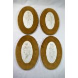 A set of four oval plaster plaques depicting classical maidens,