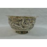 A late Victorian silver sugar bowl, with embossed decoration and wavy rim, 10cm diameter,