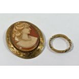 A carved shell cameo carved with the head of a maiden, housed in 9 carat gold brooch mount,