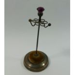 An Edwardian silver hat pin stand with purple paste thistle finial, Birmingham 1906, 11.