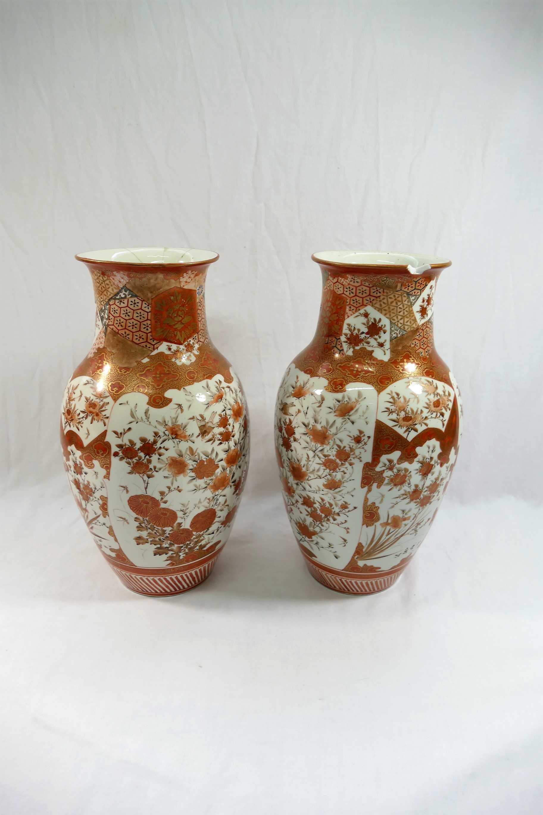 A pair of Japanese Kutani porcelain vases, decorated with birds amongst flowers,