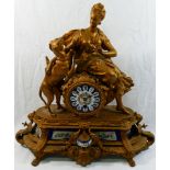 A 19th century gilt spelter figural clock, with hand painted porcelain face and panels,