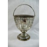 A 19th century pierced silver pedestal sugar basket, with swing handle and beaded rim, marks rubbed,