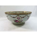 A Chinese famille rose porcelain footed bowl, hand painted with floral sprays, swags and ribbons,