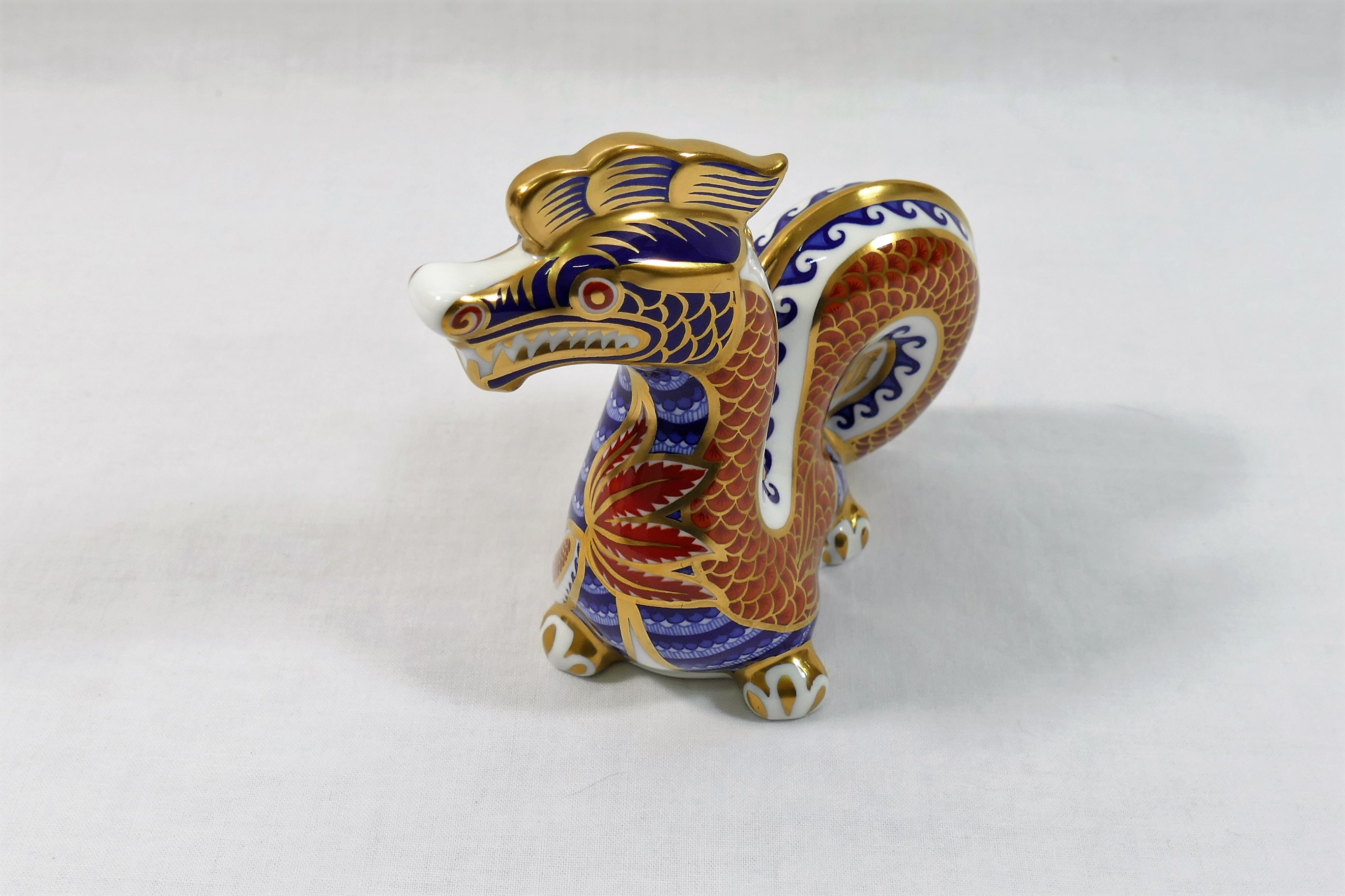 A Royal Crown Derby Chinese dragon paperweight with gold stopper, dated 1989, 11.