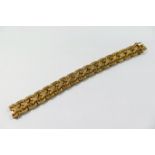 A 9 carat gold bracelet, with textured interwoven links, 15mm wide, London 1970, 46.