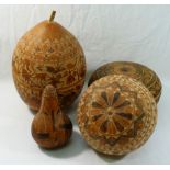 Four Peruvian gourds with traditional carved decoration, 14cm high, 16.5cm diameter, 18.