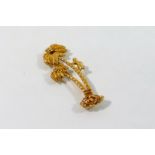 A yellow metal gold palm tree brooch, stamped '18ct', 5cm long,