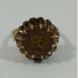 An 9 carat gold ring set with small Maximilian I of Mexico coin or token dated 1865,