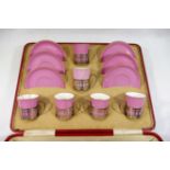 A pink ground Shelley bone china six place coffee service, the coffee cans with silver holders,