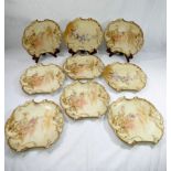 Nine late 19th century G D and Cie Limoges Rococo style porcelain dessert plates, retailed by R.